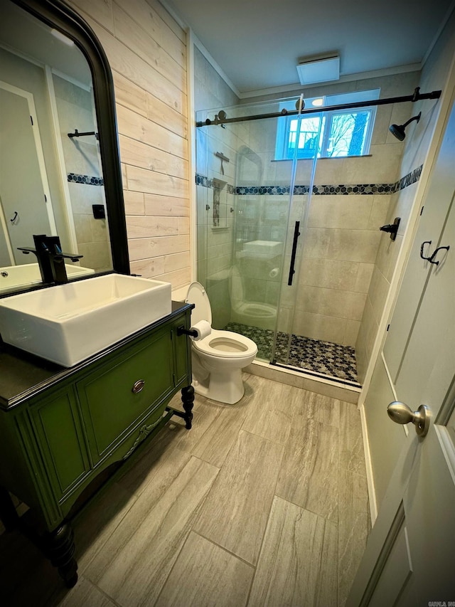 bathroom with crown molding, an enclosed shower, oversized vanity, and toilet