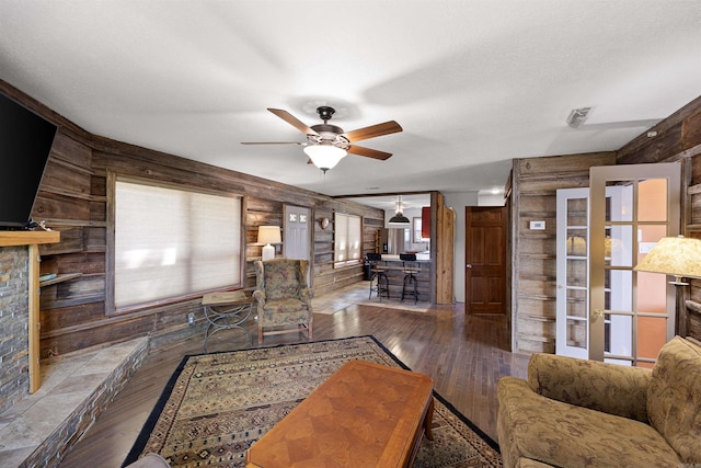 170 Ridge Rd, Houston, AR 72720 - living room with wooden walls, a ceiling fan, and hardwood / wood-style flooring