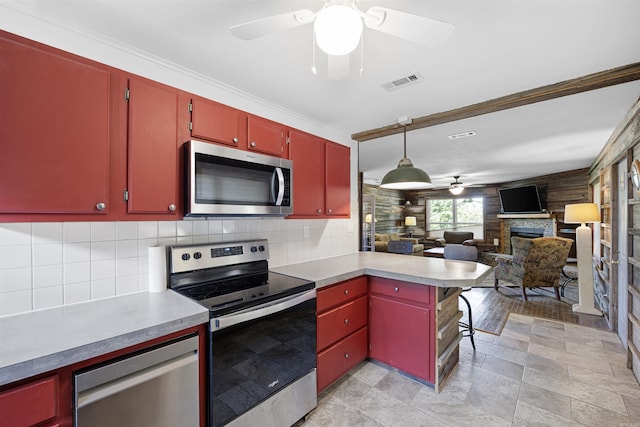 170 Ridge Rd, Houston, AR 72720 - kitchen with red cabinetry, a ceiling fan, stainless steel appliances, and visible vents