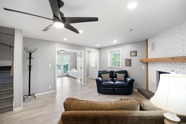 170 Ridge Rd, Houston, AR 72720 - living room featuring stairs, a ceiling fan, a brick fireplace, and a healthy amount of sunlight
