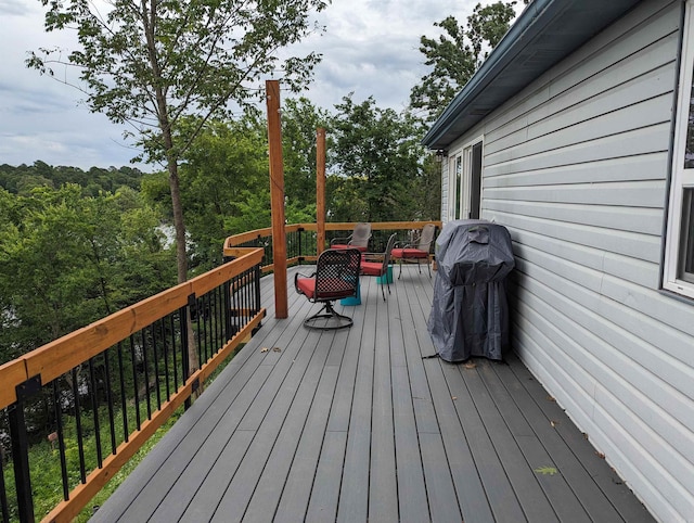 wooden deck with grilling area