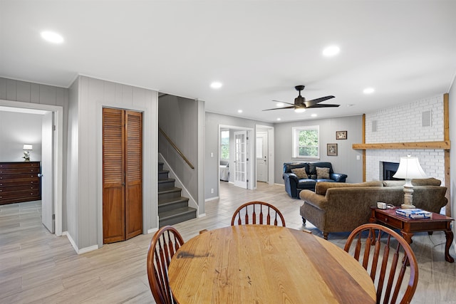 170 Ridge Rd, Houston, AR 72720 - dining space featuring stairs, a brick fireplace, baseboards, recessed lighting, and a ceiling fan