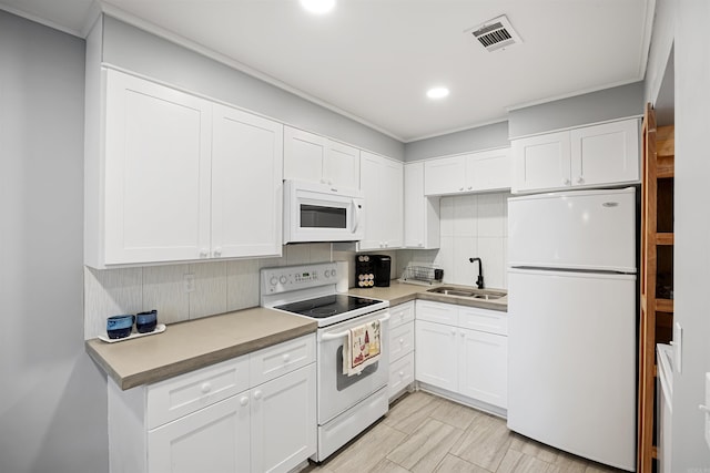 170 Ridge Rd, Houston, AR 72720 - kitchen featuring a sink, white appliances, white cabinetry, tasteful backsplash, and visible vents