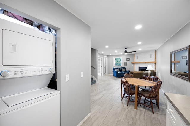 170 Ridge Rd, Houston, AR 72720 - dining space featuring a ceiling fan, a fireplace, stacked washer / drying machine, stairway, and recessed lighting