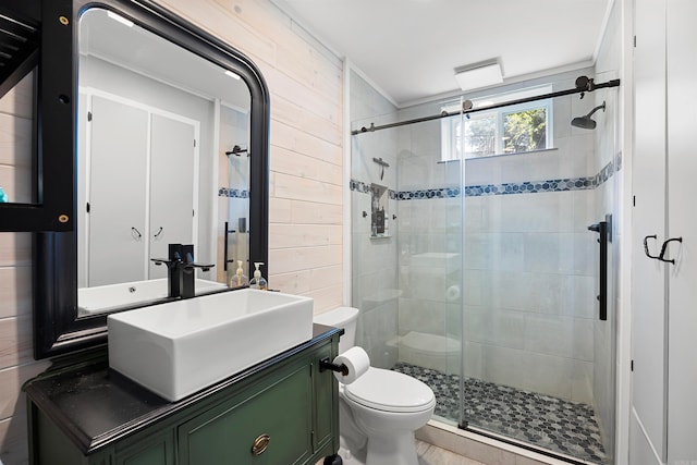 bathroom with walk in shower, large vanity, and toilet