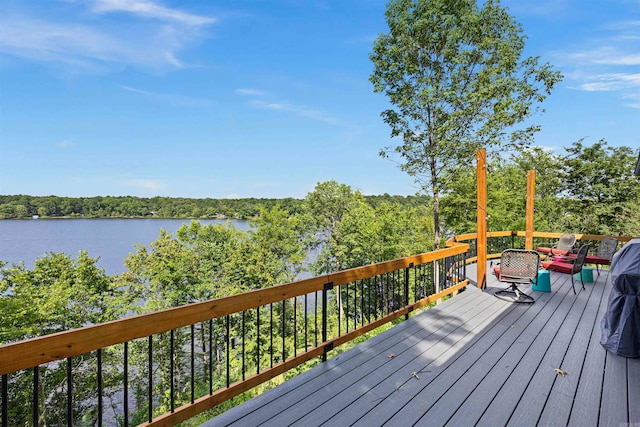 deck featuring a water view