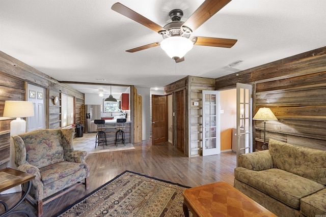 170 Ridge Rd, Houston, AR 72720 - living room featuring wooden walls, ceiling fan, and wood finished floors