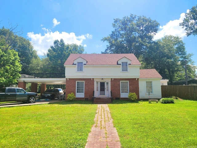 view of front of home featuring a carport and a front lawn