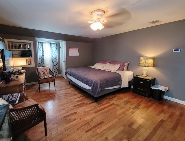 bedroom featuring hardwood / wood-style flooring and ceiling fan