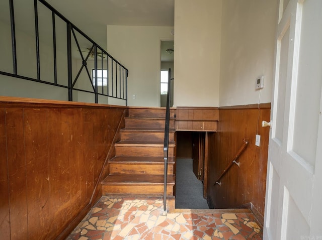 staircase with wooden walls