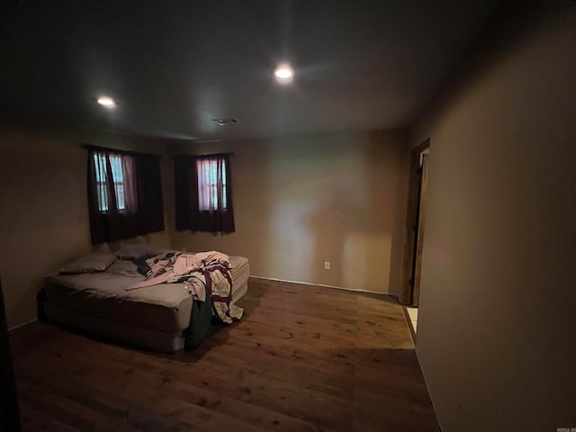 bedroom with hardwood / wood-style floors