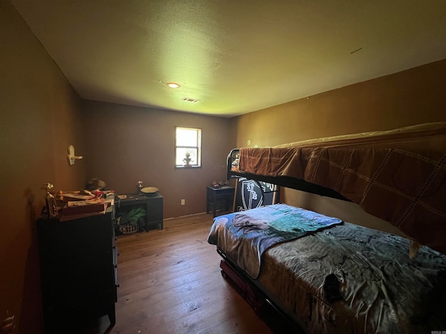 bedroom featuring hardwood / wood-style floors