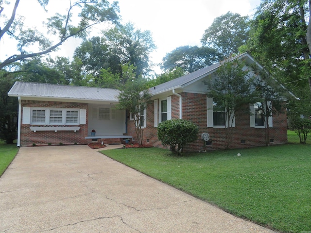 ranch-style home featuring a front yard