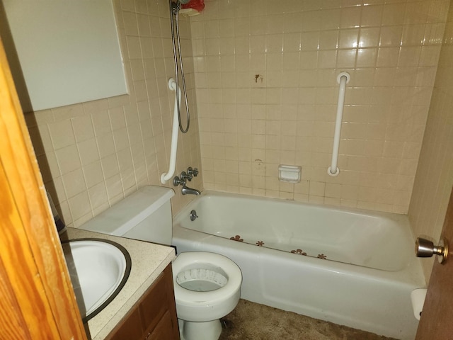 full bathroom featuring tiled shower / bath, vanity, tile walls, and toilet