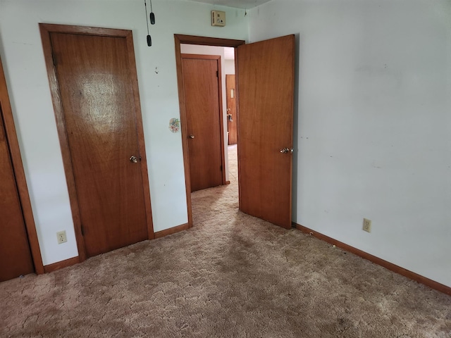 unfurnished bedroom featuring carpet floors