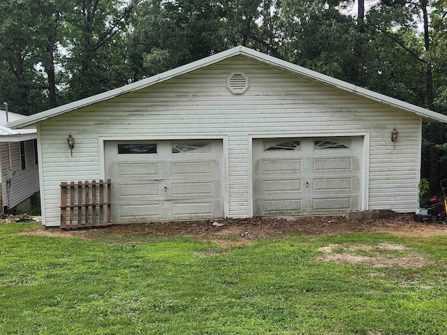 garage with a yard