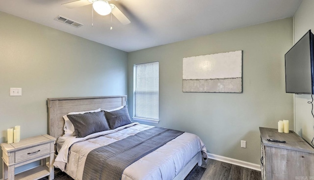 bedroom with ceiling fan and dark hardwood / wood-style flooring