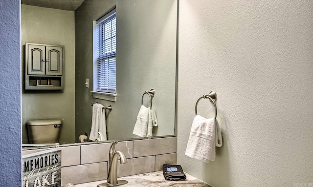 bathroom with toilet and sink