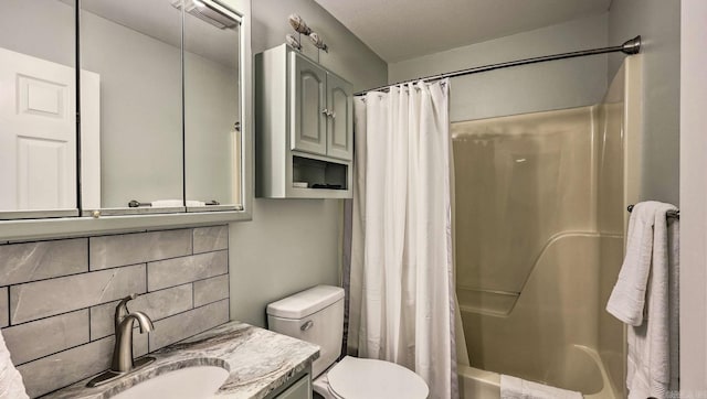 full bathroom featuring backsplash, vanity, shower / bath combination with curtain, and toilet