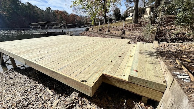 wooden deck featuring a boat dock