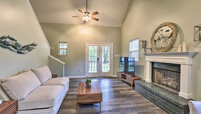 living room with french doors, dark hardwood / wood-style flooring, ceiling fan, high vaulted ceiling, and a fireplace