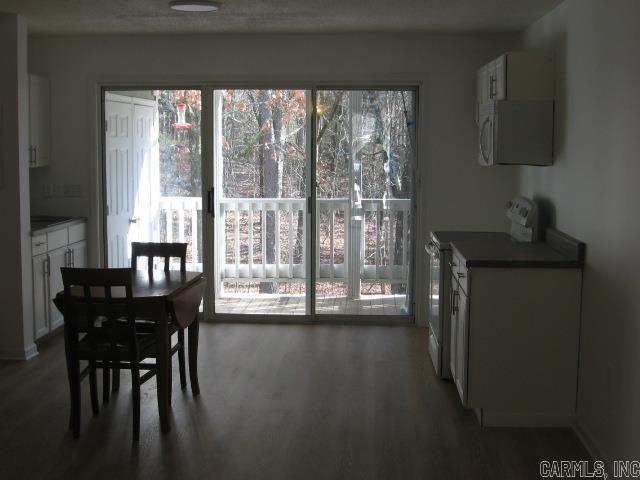 dining space featuring dark hardwood / wood-style flooring