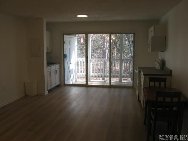 dining space with dark hardwood / wood-style flooring