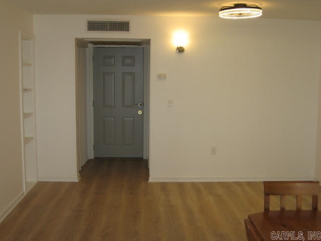 corridor featuring hardwood / wood-style flooring