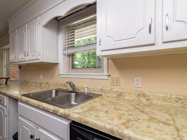 kitchen with white cabinets and sink