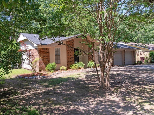 single story home featuring a garage