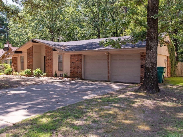 single story home with a garage