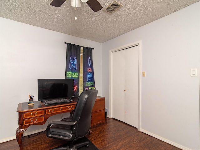 office space with ceiling fan, dark hardwood / wood-style floors, and a textured ceiling