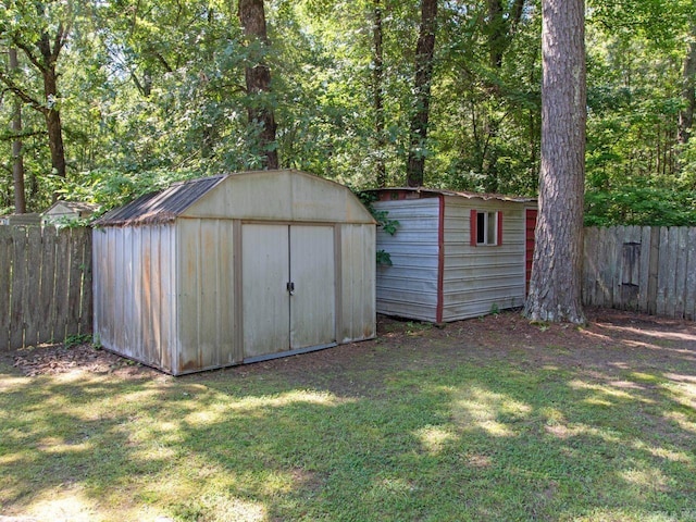 view of outbuilding with a lawn