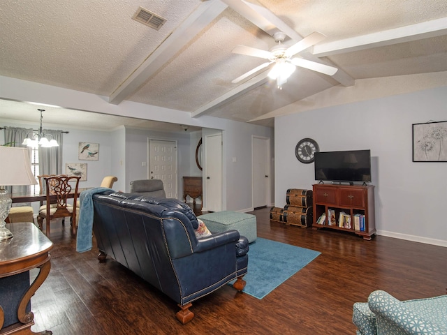 living room featuring a textured ceiling, dark hardwood / wood-style flooring, lofted ceiling with beams, and ceiling fan with notable chandelier