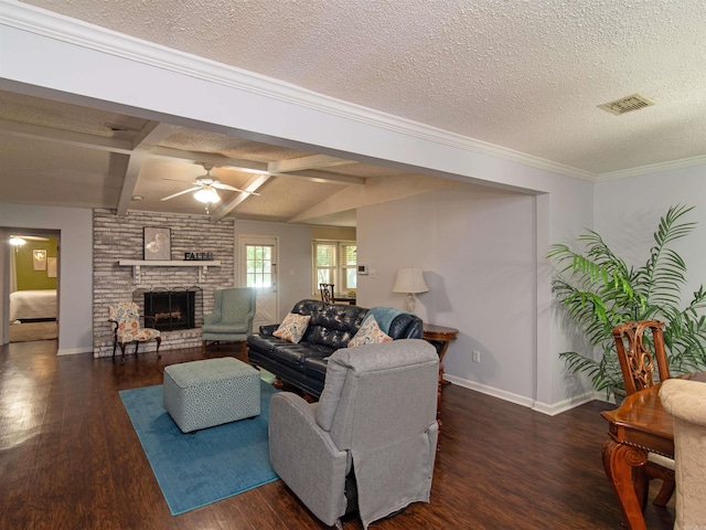 living room featuring dark wood-type flooring, a brick fireplace, ceiling fan, vaulted ceiling with beams, and a textured ceiling