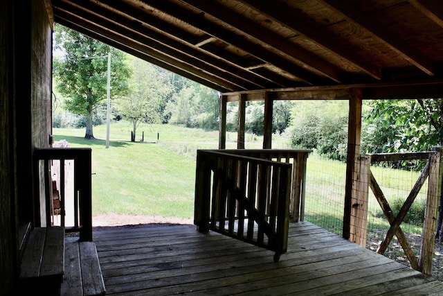 wooden terrace with a yard