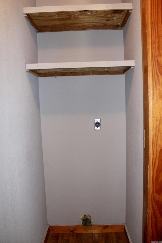 washroom with laundry area, wood finished floors, electric dryer hookup, and baseboards