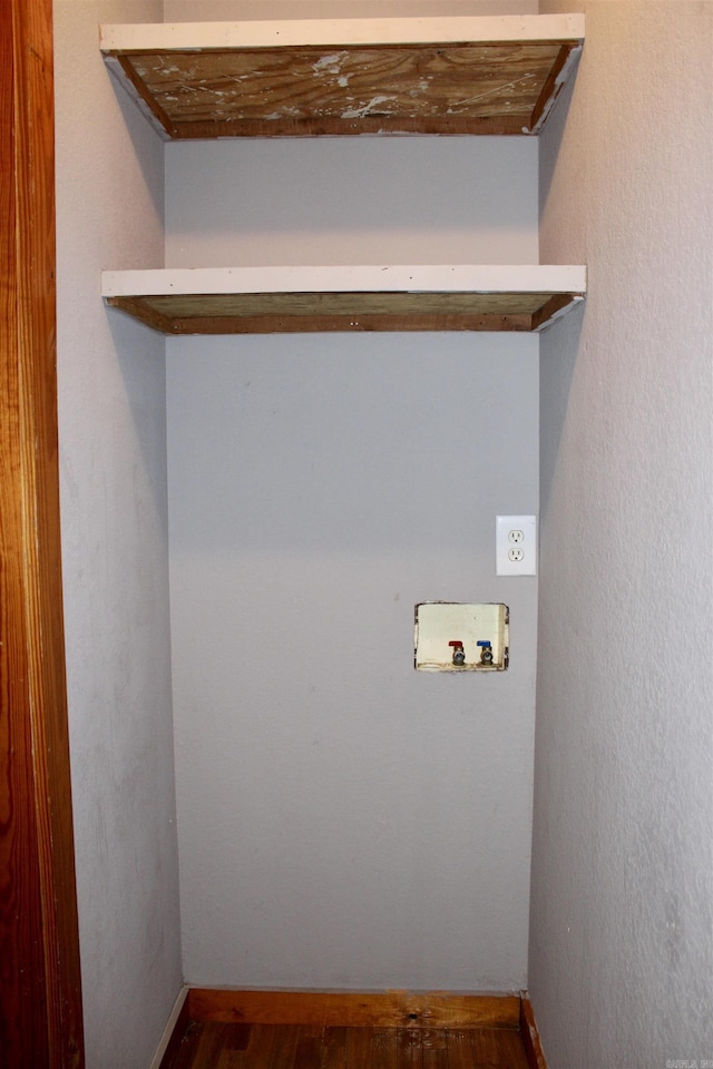 washroom featuring laundry area, hookup for a washing machine, and wood finished floors