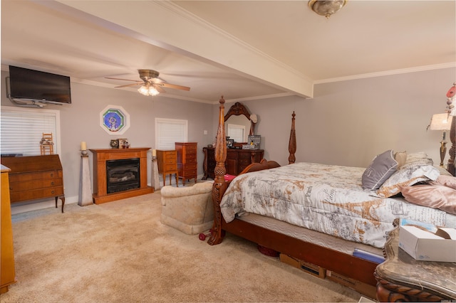 carpeted bedroom featuring beamed ceiling, ceiling fan, and ornamental molding