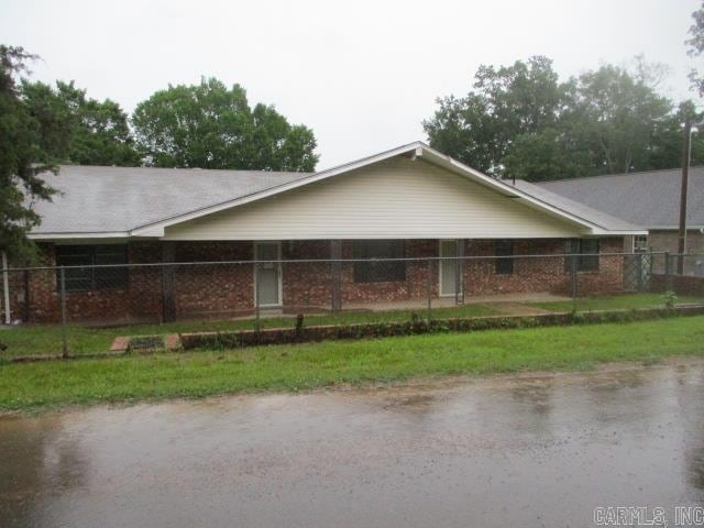 view of side of home with a carport