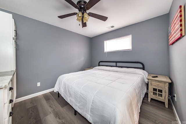 bedroom with dark wood-type flooring and ceiling fan