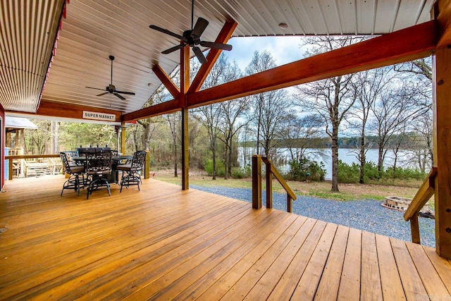 wooden deck featuring ceiling fan