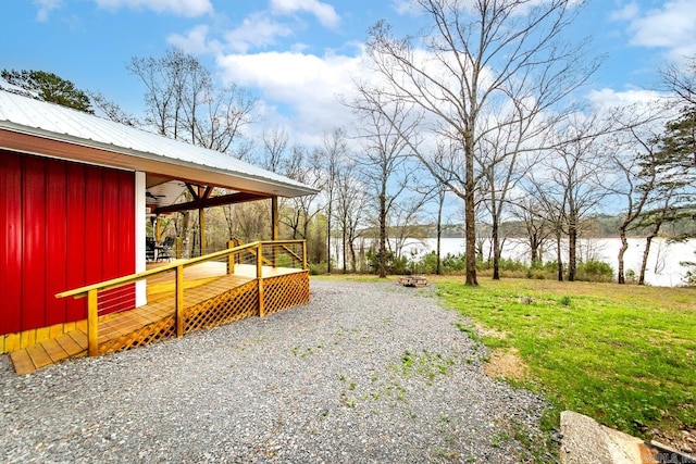 view of yard featuring a deck with water view