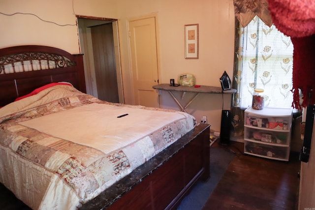 bedroom featuring dark hardwood / wood-style floors