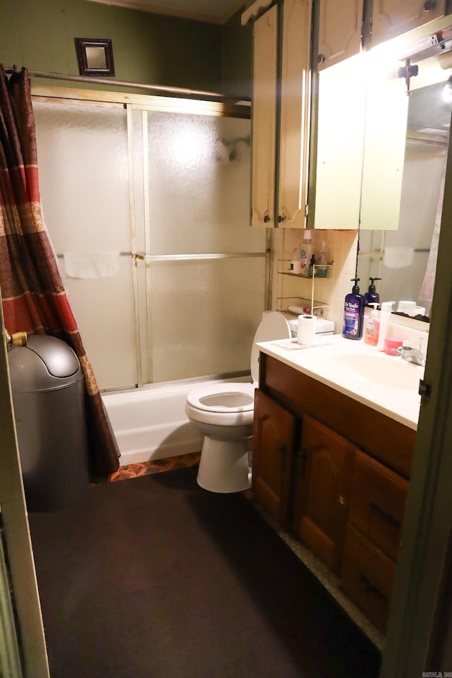 full bathroom featuring shower / bath combination with glass door, tasteful backsplash, vanity, and toilet