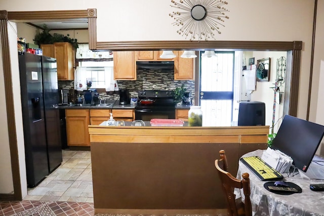 kitchen featuring black appliances, tasteful backsplash, plenty of natural light, and light tile floors