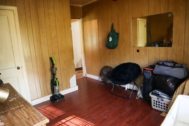 home office featuring dark hardwood / wood-style floors and wood walls