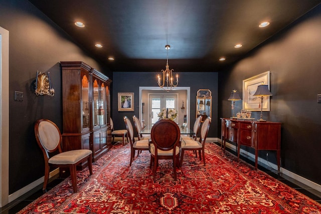 dining area featuring french doors, an inviting chandelier, recessed lighting, and baseboards