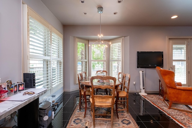 dining area featuring baseboards, dark tile patterned floors, a chandelier, and recessed lighting