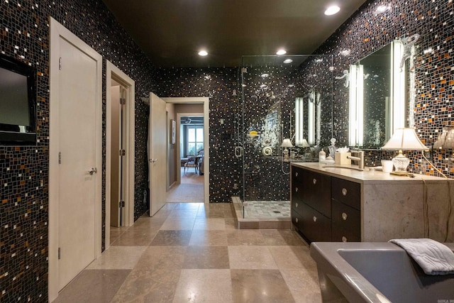 full bath featuring backsplash, a shower stall, vanity, and recessed lighting